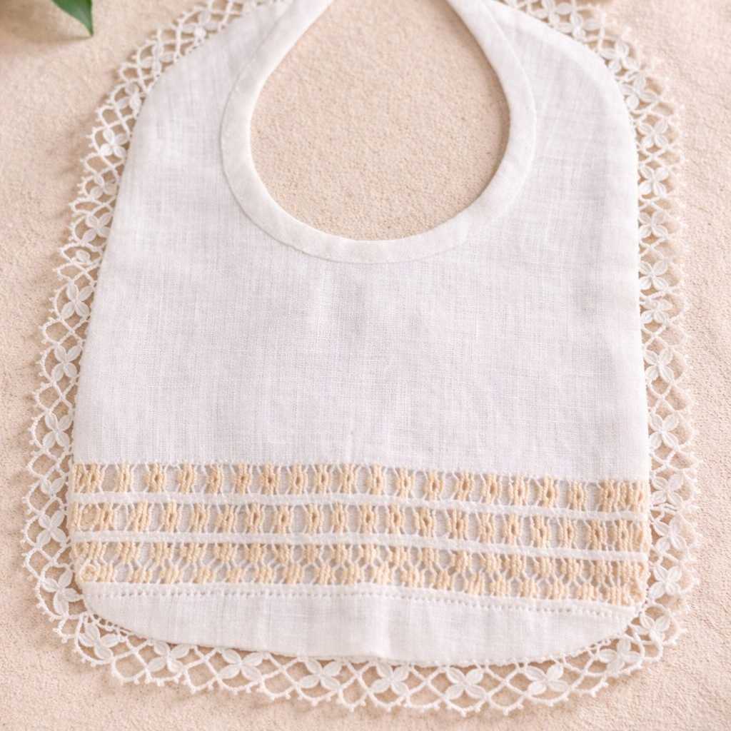 BABERO TELA  LINO BORDADO A MANO